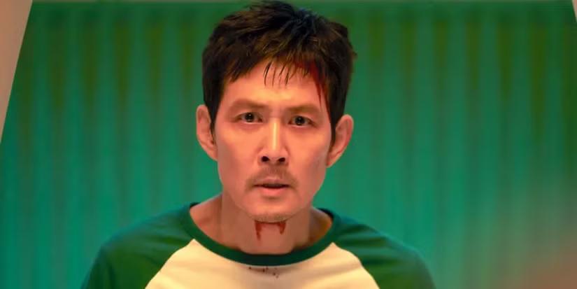 gi hun with blood on his neck in squid game ۷ تئوری برتر برای ساخت اسپین آف آمریکایی Squid Game - گیمفا